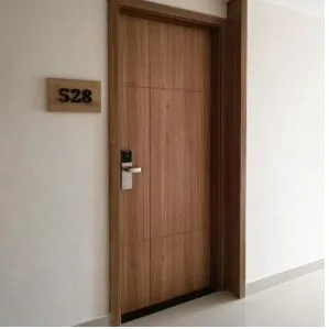 Wooden hotel room door with card lock